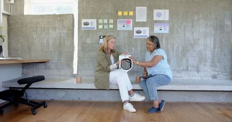 Creative Female Team Collaborating on Innovative VR Headset Design