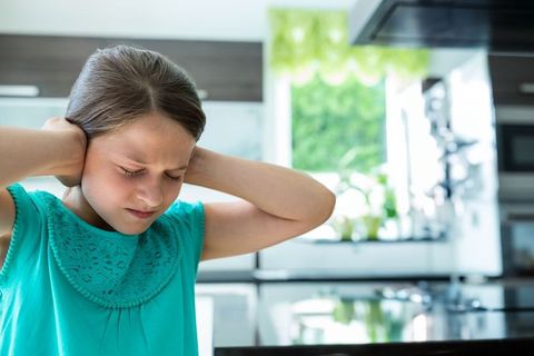 Girl Experiencing Sensory Overload in Modern Kitchen Environment - Download Free Stock Images Pikwizard.com
