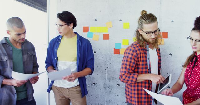 Young Team Collaborating in Modern Office with Colorful Sticky Notes - Download Free Stock Images Pikwizard.com