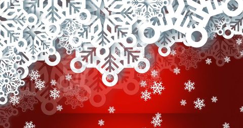 Intricate white snowflakes on festive red background