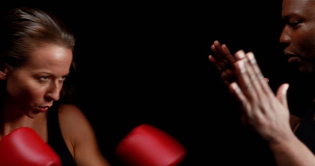 Determined Woman Practicing Boxing Techniques with Coach - Download Free Stock Images Pikwizard.com