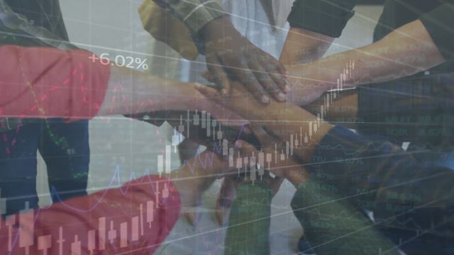 This visual blend of hands stacking demonstrates teamwork and unity amidst the dynamic world of finance. The overlay of stock market data emphasizes the group's focus on shared financial goals and collective business strategies. Perfect for use in articles or presentations exploring concepts of teamwork, finance, global markets, or professional cooperation.