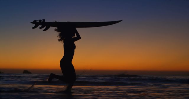 Silhouette of Woman Surfing at Sunset with Vibrant Sky - Download Free Stock Images Pikwizard.com