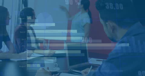 Diverse Team Analyzing Data Visualization Presentation in Office