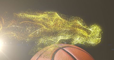 Basketball with Glowing Gold Particles Emphasizing Motion