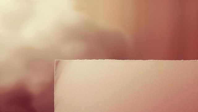 Minimalist torn edge paper with warm gradient backdrop