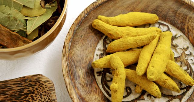 Fresh Turmeric Roots and Bay Leaves in Wooden Bowls - Download Free Stock Images Pikwizard.com