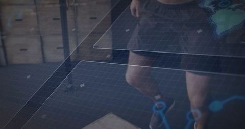 Athlete interacting with digital fitness hud over plyo box in gym, legs and sneakers