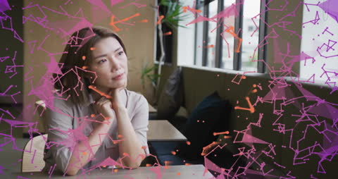 Pensive Businesswoman amidst Dynamic Data Visualization