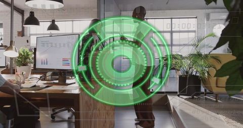 Business consultants shaking hands in modern open office with green digital hud overlay