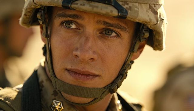 Closeup young soldier in desert helmet and camouflage uniform showing rank insignia