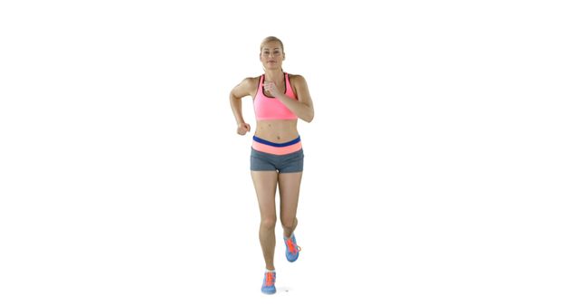 A young Caucasian woman is jogging on the spot, wearing athletic gear, with copy space. Her focused expression and active posture suggest a commitment to fitness and a healthy lifestyle.
