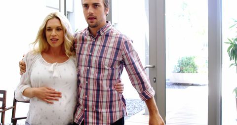 Expectant Couple Walking Together in Hospital