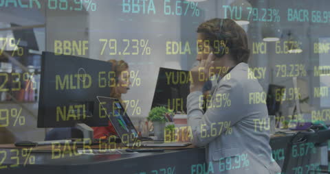 Businesswoman Analyzing Data with Overlay of Financial Statistics