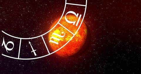 Zodiac symbols over solar globe against starry night sky