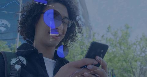 Young man checking smartphone with augmented analytics overlays on urban glass facade