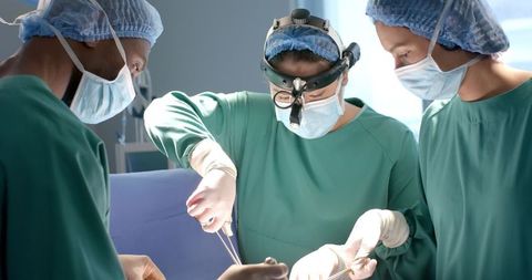 Surgeons Collaborating in Surgical Operation Room