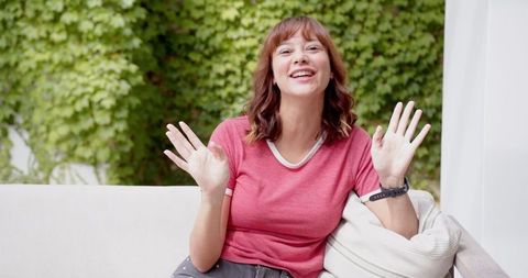 Cheerful Woman Outdoors on Video Call Smiling