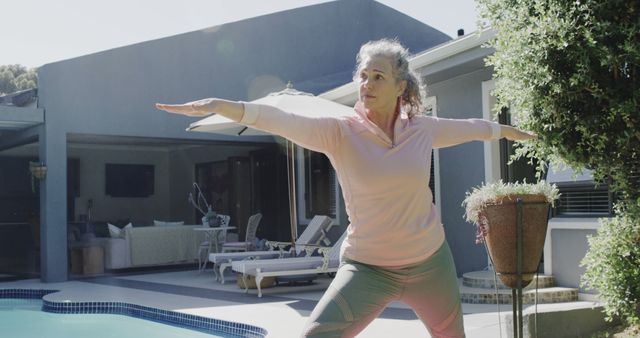 Senior Woman Practicing Yoga by the Poolside - Download Free Stock Images Pikwizard.com