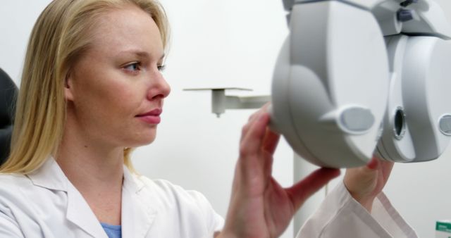 Female Optometrist Adjusting Vision Testing Equipment - Download Free Stock Images Pikwizard.com