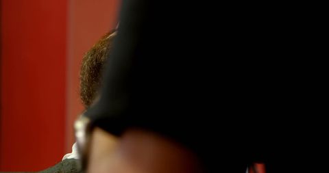 Close-Up of Person Against Vibrant Red Background