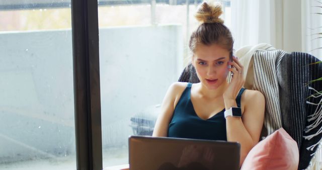 Young Woman Working Remote with Laptop and Smartphone - Download Free Stock Images Pikwizard.com