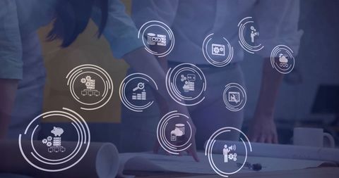 Engineers Collaborating on Blueprint with Futuristic Icons