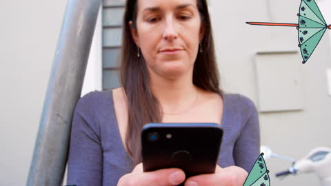 Woman Using Smartphone Outdoors with Overlaying Umbrella Graphics