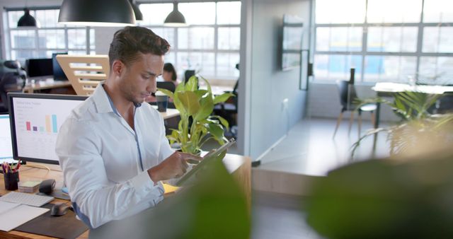 Young Businessman Using Digital Tablet in Modern Office - Download Free Stock Images Pikwizard.com