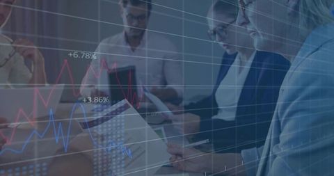 Executive team reviewing financial reports with overlaid data visualization in boardroom