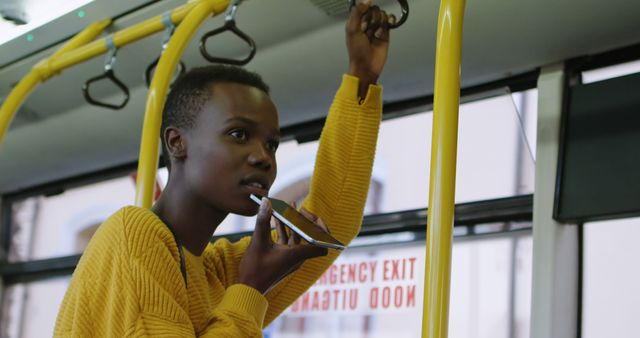 Young Woman Using Voice Assistant on Bus Holding Handrail - Download Free Stock Images Pikwizard.com