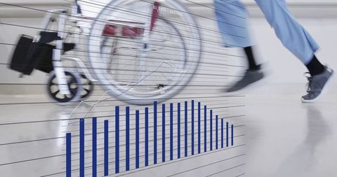 Nurse pushing wheelchair down hospital corridor with healthcare analytics chart overlay