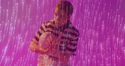 Woman Interacting with Digital Light Effects in Futuristic Studio