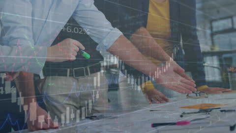 Collaborative Team Analyzing Financial Indices in Office