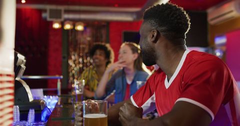 Diverse Friends Enjoy Watching Sports Game at Bar - Download Free Stock Images Pikwizard.com