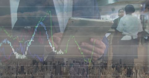 Corporate Professional Analyzing Financial Markets on Tablet