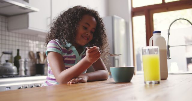 Young Girl Enjoying Breakfast in Cozy Modern Kitchen - Download Free Stock Images Pikwizard.com