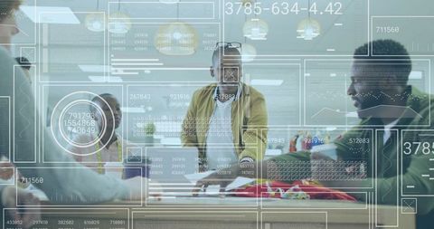 Creative Team Collaborating with Augmented Reality Data Overlay During Office Presentation