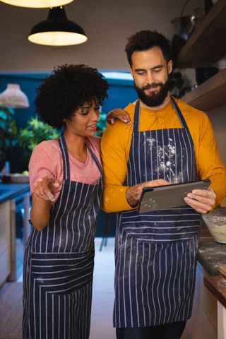 Couple Cooking Together in Kitchen with Digital Tablet for Recipe - Download Free Stock Images Pikwizard.com