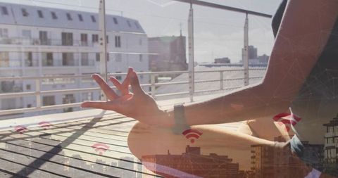Urban meditation on rooftop with smartwatch and wi-fi connectivity double exposure