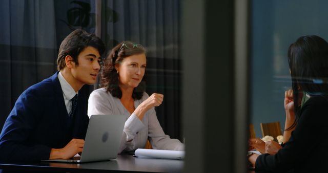 Team Having Discussion in Meeting Room with Laptops - Download Free Stock Images Pikwizard.com