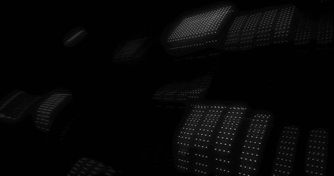 Glowing perforated panels floating in dark space displaying white dot grid and depth