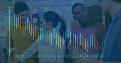 Diverse Team Analyzing Data and Brainstorming in Modern Office