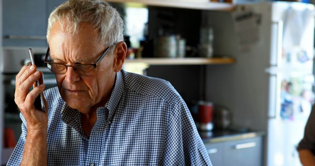 Senior Man Taking Mobile Phone Call in Home Kitchen - Download Free Stock Images Pikwizard.com