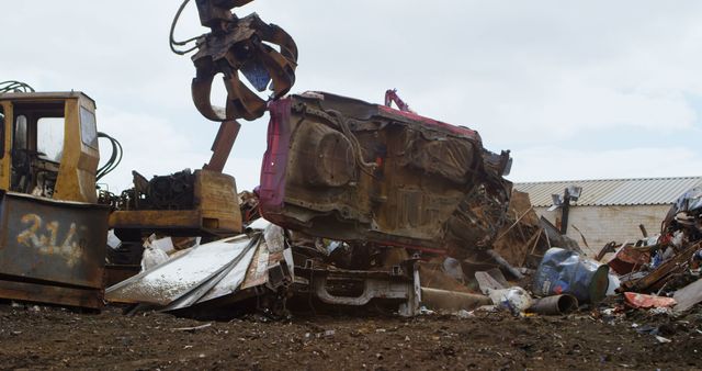 Heavy Machinery Lifting Crashed Car at Scrap Yard - Download Free Stock Images Pikwizard.com