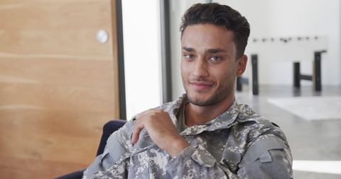 Smiling Young Male Soldier Relaxing at Home in Armchair - Download Free Stock Images Pikwizard.com
