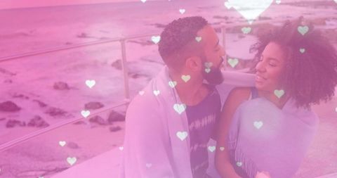 Couple Embracing on Scenic Seaside Deck in Pastel Heart Overlay