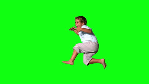 Energetic Boy Jumping and Shouting on Green Screen