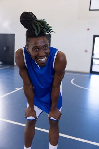 Energetic Basketball Player Smiling after a Game on Court