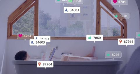 Woman enjoying relaxation in modern home bathtub with social media attachments